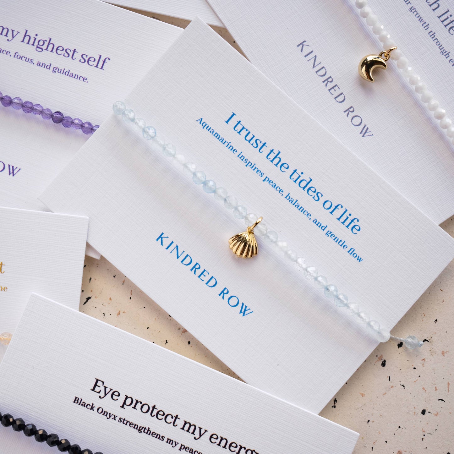 Kindred Row - Aquamarine Shell Affirmation Charm Bracelet